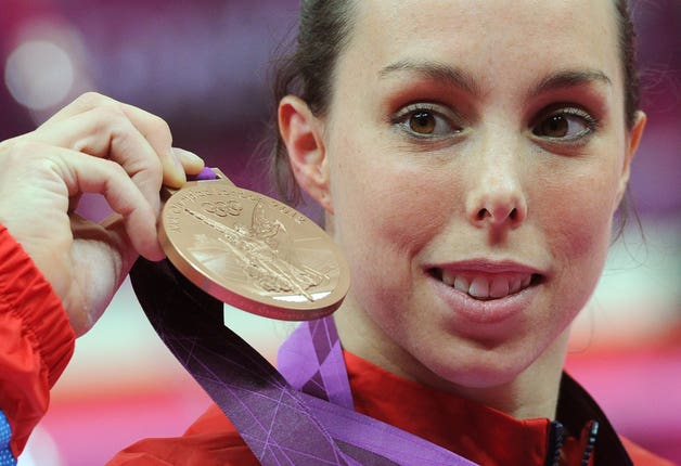 Great Britain’s Beth Tweddle celebrates with her bronze medal after the women’s uneven bars final at London 2012