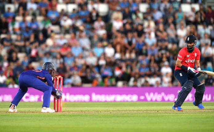 India’s Dinesh Karthik, left, runs out England’s Moeen Ali