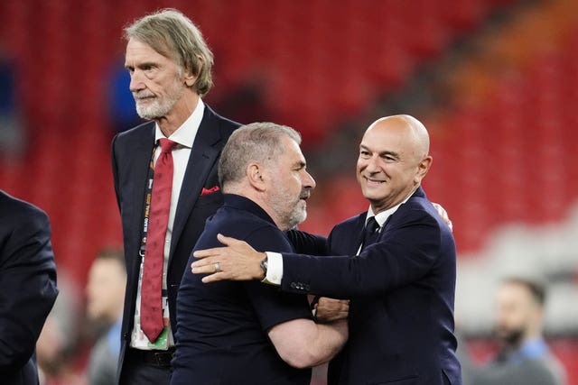 Ange Postecoglou, left, and Daniel Levy embrace following Tottenham's Europa League final win over Manchester United