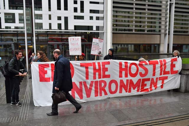 Demonstrators protested against the hostile environment immigration policy outside the Home Office (Dominic Lipinski/PA)