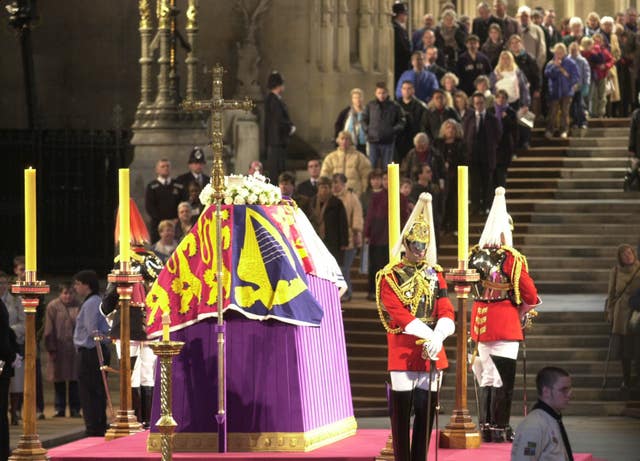 People filing past the coffin of Queen Elizabeth The Queen Mother, in Westminster Hall in 2002