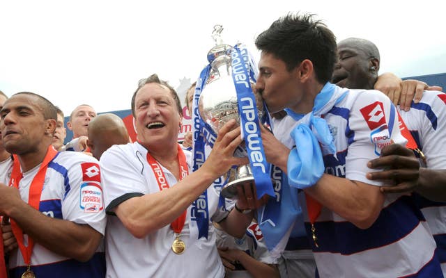 Warnock helps lift the Championship trophy as QPR win promotion in 2011