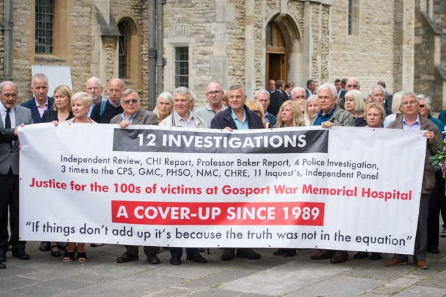 Members of the families of people who died at Gosport War Memorial Hospital outside Portsmouth Cathedral after the disclosure of the Gosport Independent Panel’s report (Dominic Lipinski/PA)