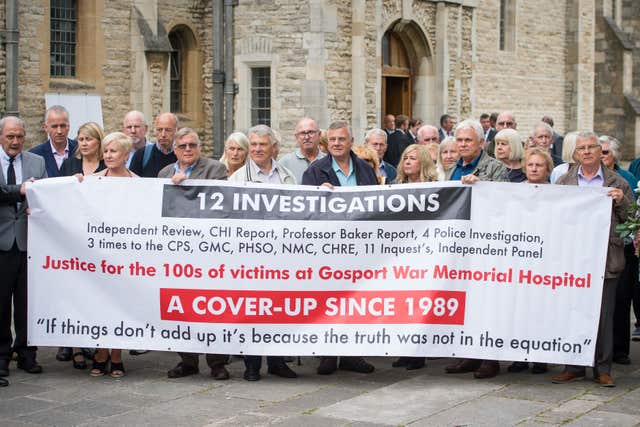 Members of the families of people who died at Gosport War Memorial Hospital outside Portsmouth Cathedral after the disclosure of the Gosport Independent Panel's report (Dominic Lipinski/PA)