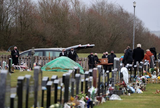 The coffin of Nicole Anderson is carried to the graveside