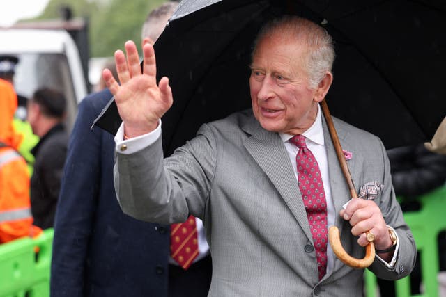 Charles waved to people during a visit to Grimsby