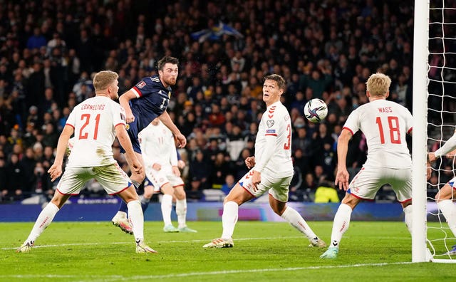 Scotland's John Souttar, second left, scores against Denmark in November 2021