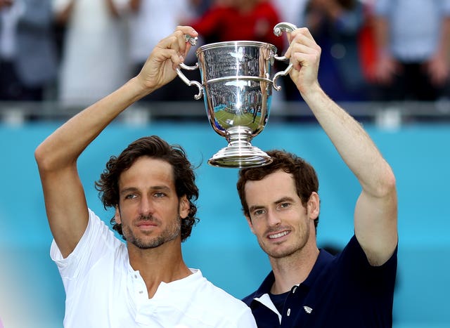 Andy Murray (right) and Feliciano Lopez (left) hold up the doubles trophy at Queen's Club