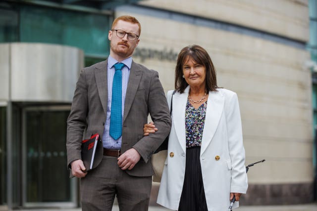 Alice Lockard, the sister of Thomas Lockard, with solicitor Owen Winters, outside Laganside Courts