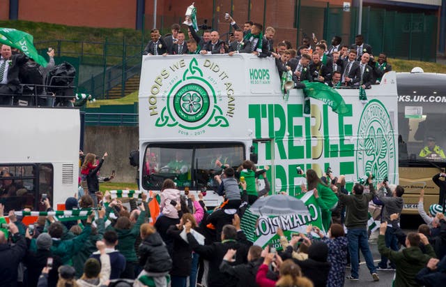 Celtic celebrate winning the triple treble with an open top bus parade