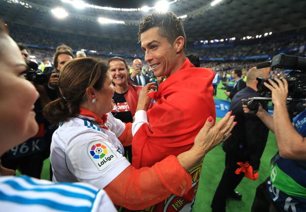 Real Madrid's Cristiano Ronaldo celebrates with his mother Dolores after winning the UEFA Champions League final in Kiev
