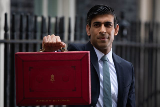 Rishi Sunak holding up the red box before the 2021 Budget