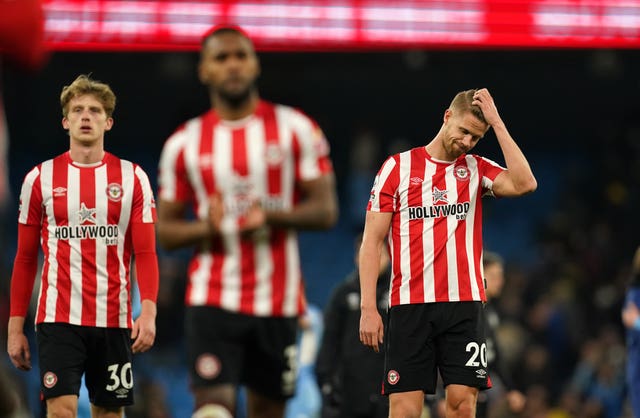 Brentford’s Kristoffer Ajer looks dejected