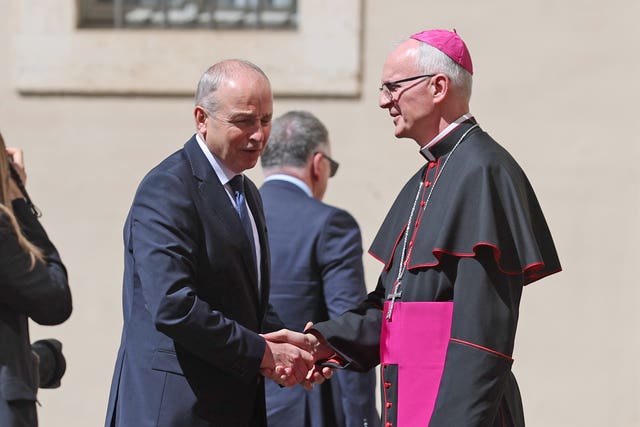 Prefect of the Papal Household Petar Rajic (right) welcomes Taoiseach Micheal Martin in San Damasso Courtyard, Vatican City