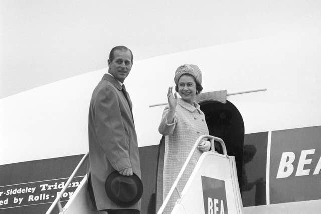 The Queen and the Duke of Edinburgh board their Trident airliner of British European Airways at Heathrow Airport, on their way to Malta for a four-day visit (PA)