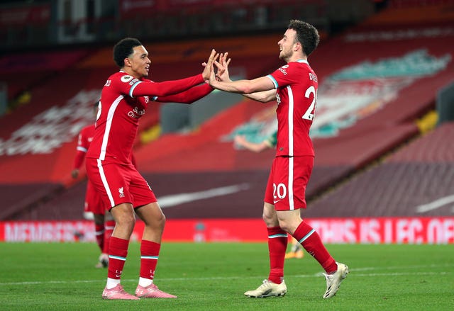 Trent Alexander-Arnold congratulates Diogo Jota after a goal for Liverpool