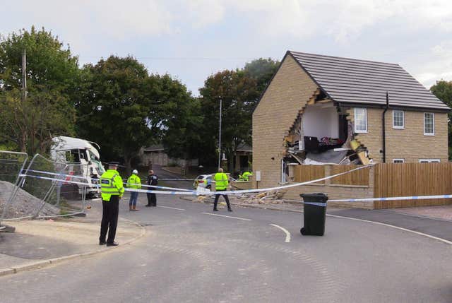 A police cordon in Barnsley, where a house has been left severely damaged after being hit by a lorry