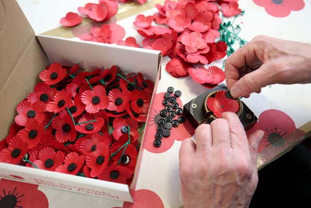 Commemorative poppies being manufactured by hand