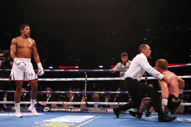 Anthony Joshua, left, floored Povetkin twice in the seventh round