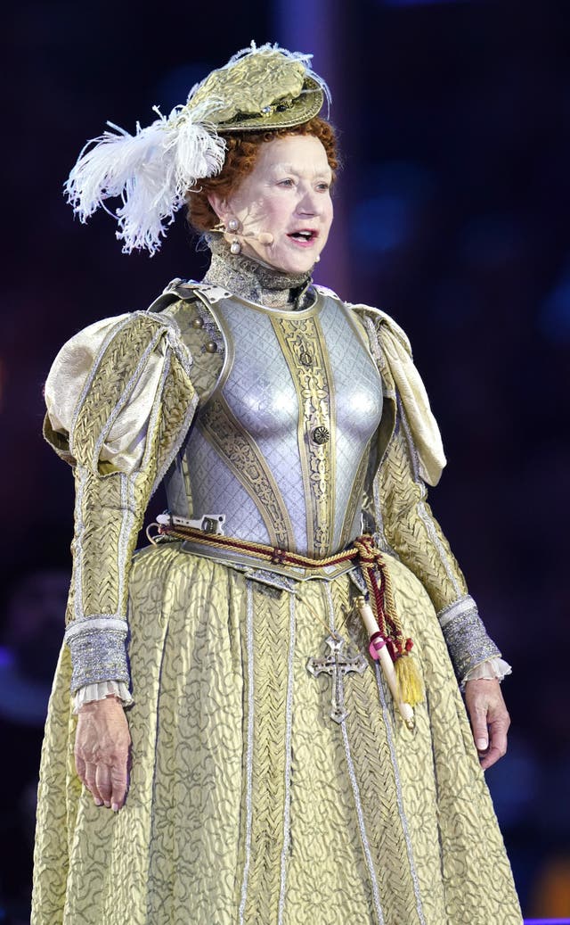 Dame Helen Mirren dressed as Queen Elizabeth I performs