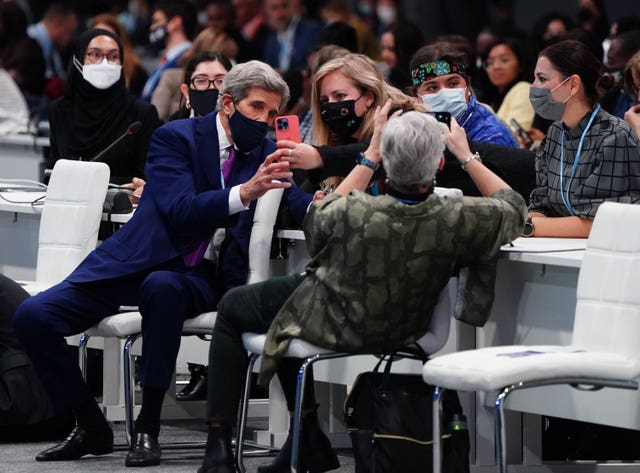 US Special Presidential Envoy for Climate, John Kerry takes selfies with audience members
