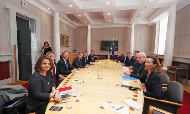 Donald Tusk, fourth left, and Leo Varadkar, third right, at Government Buildings in Dublin