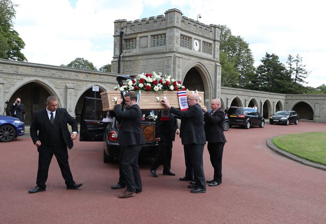 The coffin of Jack Charlton is taken into West Road Crematorium in Newcastle for his funeral