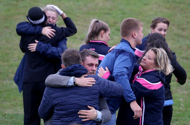 Players and club officials following a minute’s silence at East Grinstead rugby club
