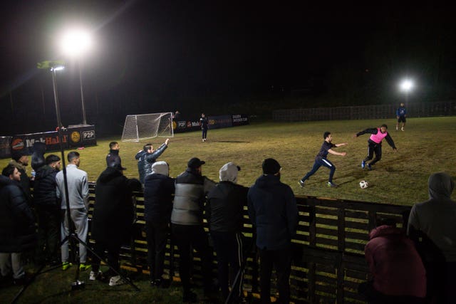 Spectators watch the game