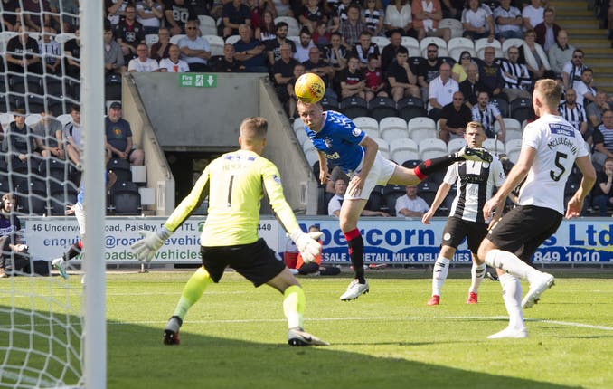 Scott Arfield, centre, heads at goal