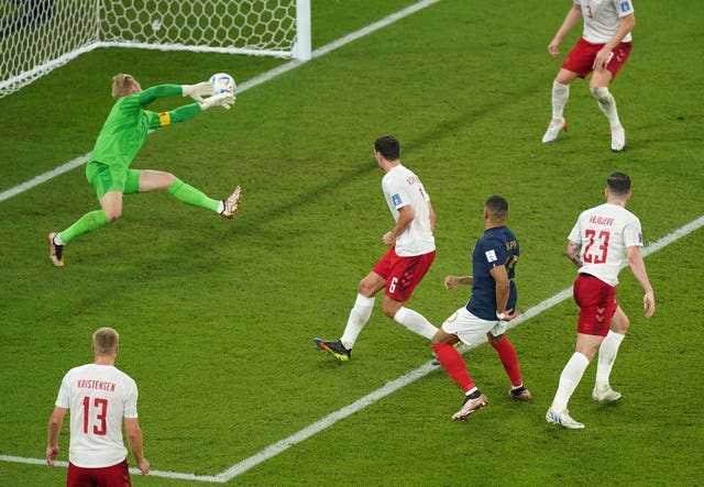 Kylian Mbappe, centre, scores France’s first goal against Denmark