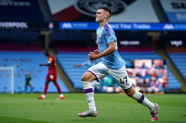 Phil Foden celebrates scoring Manchester City''s third 