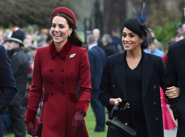 The Duchess of Cambridge and the Duchess of Sussex were all smiles as they walked side by side to church (Joe Giddens/PA Wire)