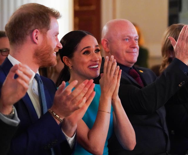 The Duke and Duchess of Sussex cheer during a marriage proposal at the Endeavour Fund Awards at Mansion House in London