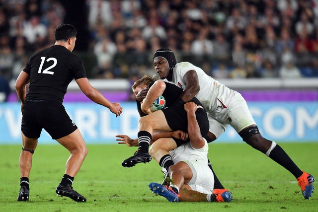Maro Itoje, right, makes a tackle on New Zealand's Jack Goodhue
