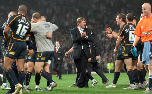 Tony Smith, centre, celebrated success following his final match as Leeds head coach