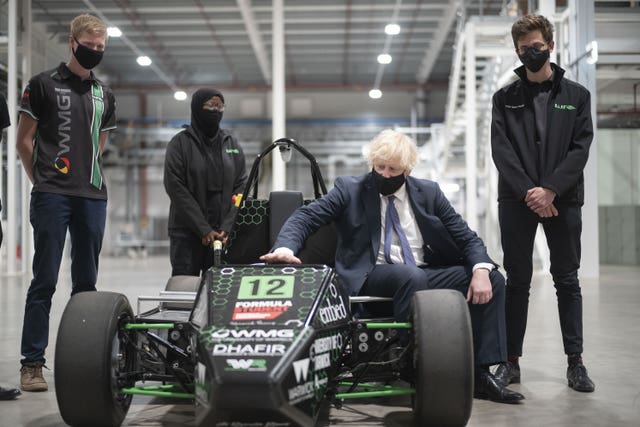 Prime Minister Boris Johnson with an electric car developed by Warwick University engineering students during his visit to the UK Battery Industrialisation Centre in Coventry
