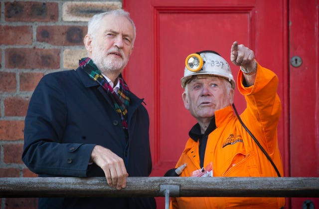Labour leader Jeremy Corbyn meets former miner John Kane, aged 82, during a visit to the National Mining Museum at the former Lady Victoria Colliery, Newtongrange