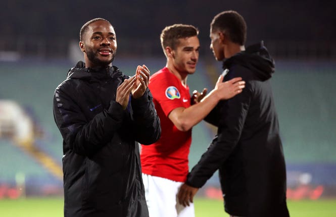 Raheem Sterling applauds fans after the final whistle