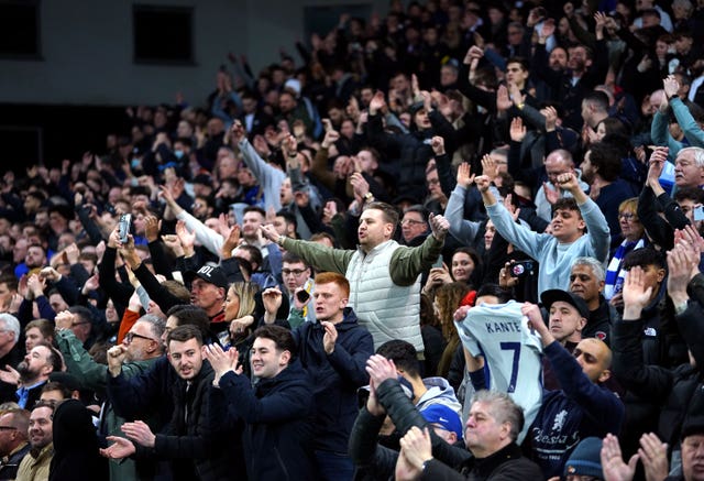 Chelsea fans celebrate their victory at Carrow Road