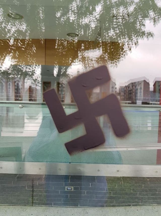 A swastika spray painted on a window of the Riverfront Theatre in Newport 