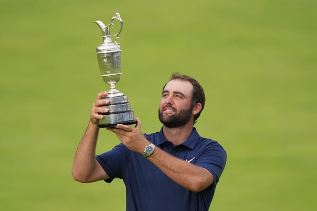 Scottie Scheffler holds up the Claret Jug after winning The Open