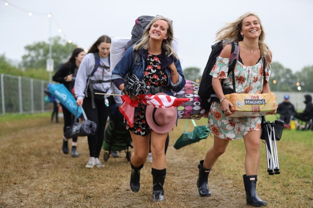 People arrive on the first day of the Glastonbury Festival