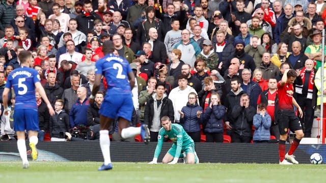 Manchester United goalkeeper David de Gea sits dejected after Chelsea's Marcos Alonso (not pictured) scores his side's first goal of the game during the Premier League match at Old Trafford, Manchester 