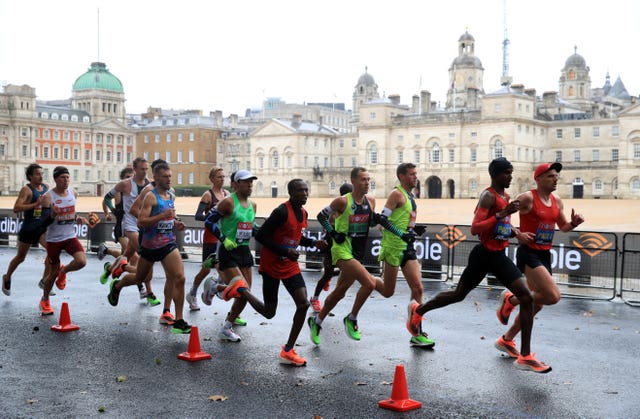 Athletes make their way past Horse Guards Parade