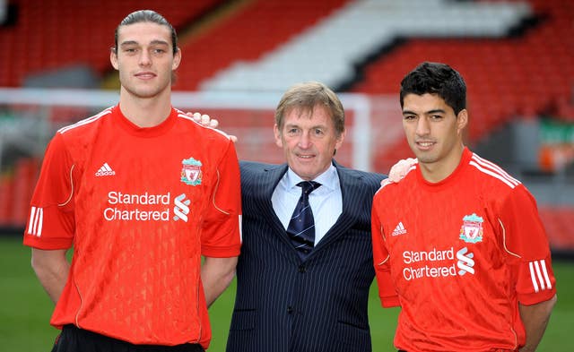 Andy Carroll (left) and Luis Suarez (right) with manager Kenny Dalglish