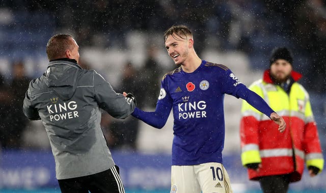 Leicester City's James Maddison (right) and manager Brendan Rodgers celebrate 