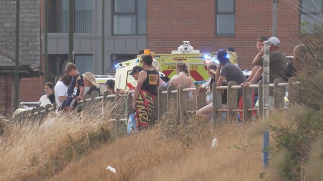 People at the scene after three people got into difficulty at Shoreham-by-Sea
