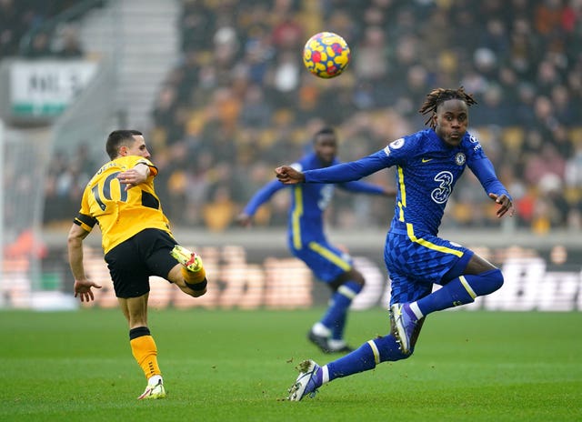 Wolves'' Daniel Podence and Chelsea’s Trevoh Chalobah, right, battle for the ball