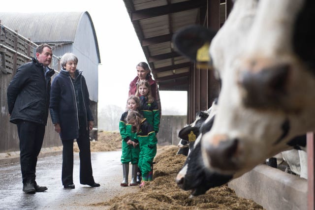 The Prime Minister is shown around Fairview Farm by owners Stephen and Susanne Jackson and their daughters Hannah, Abbie and Emil) in Bangor, Northern Ireland (Stefan Rousseau/PA)